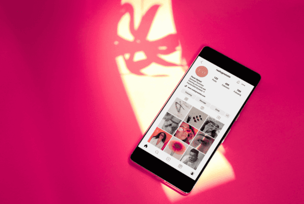 Social Media Content Planning: Expert Guide to Elevate Your Business 1 social media content planning on instagram, a phone on a pink background