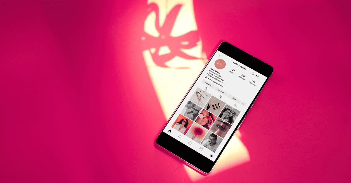 Social Media Content Planning: Expert Guide to Elevate Your Business 1 social media content planning on instagram, a phone on a pink background