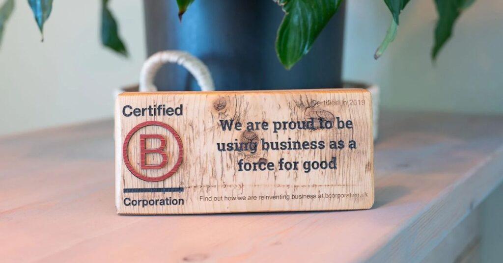 Sustainable business practices: b-corp sign on a desk saying Solve are B-corp certified
