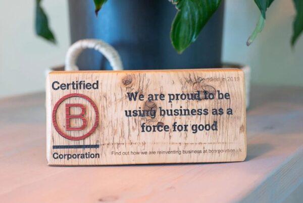 Sustainable business practices: b-corp sign on a desk saying Solve are B-corp certified