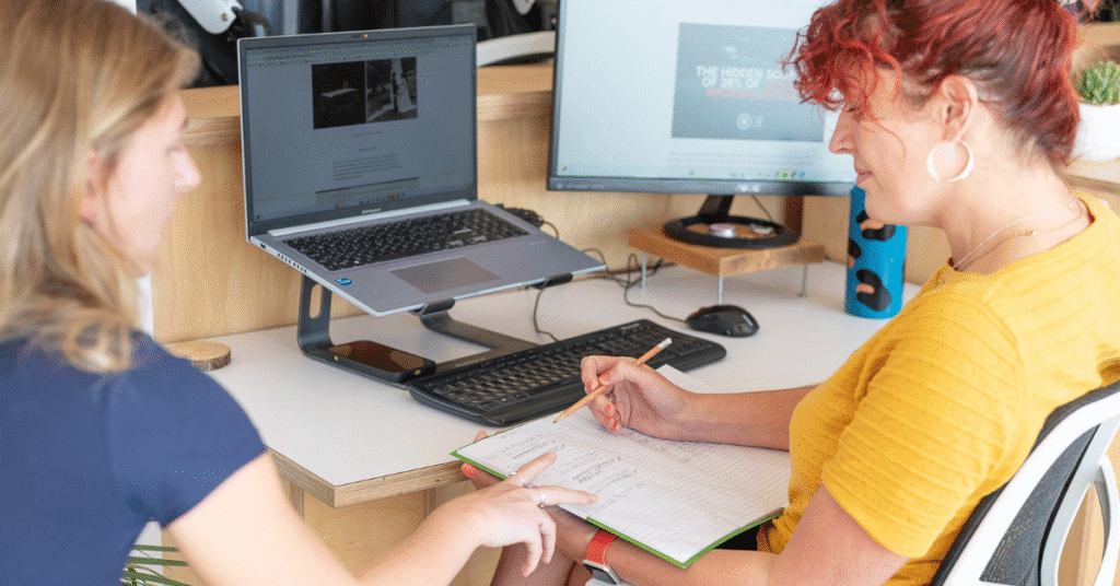 SEO content creation being planned by two team members
