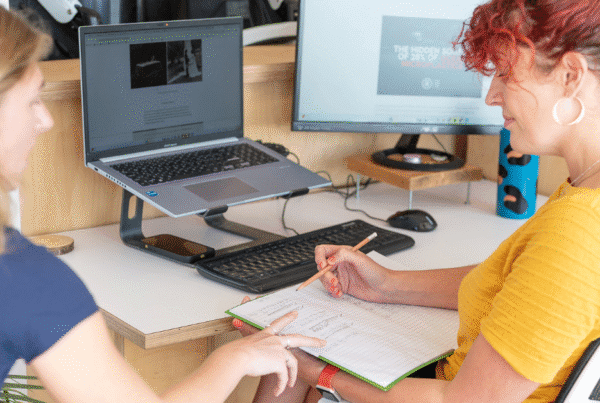 SEO content creation being planned by two team members