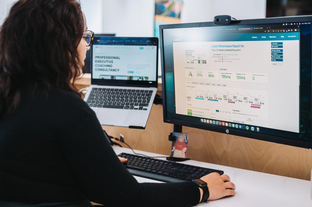 Solve's head web developer looking at a screen showing positive results from regular website maintenance