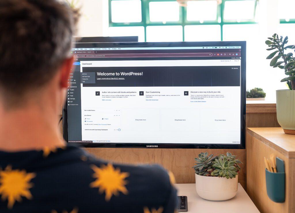 When Should You Redesign Your Website? Top 8 Telltale Signs 4 Website maintenance explained. A team member of Solve working on a wordpress website.