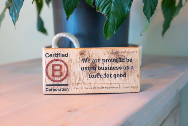 Sustainable business practices: b-corp sign on a desk saying Solve are B-corp certified