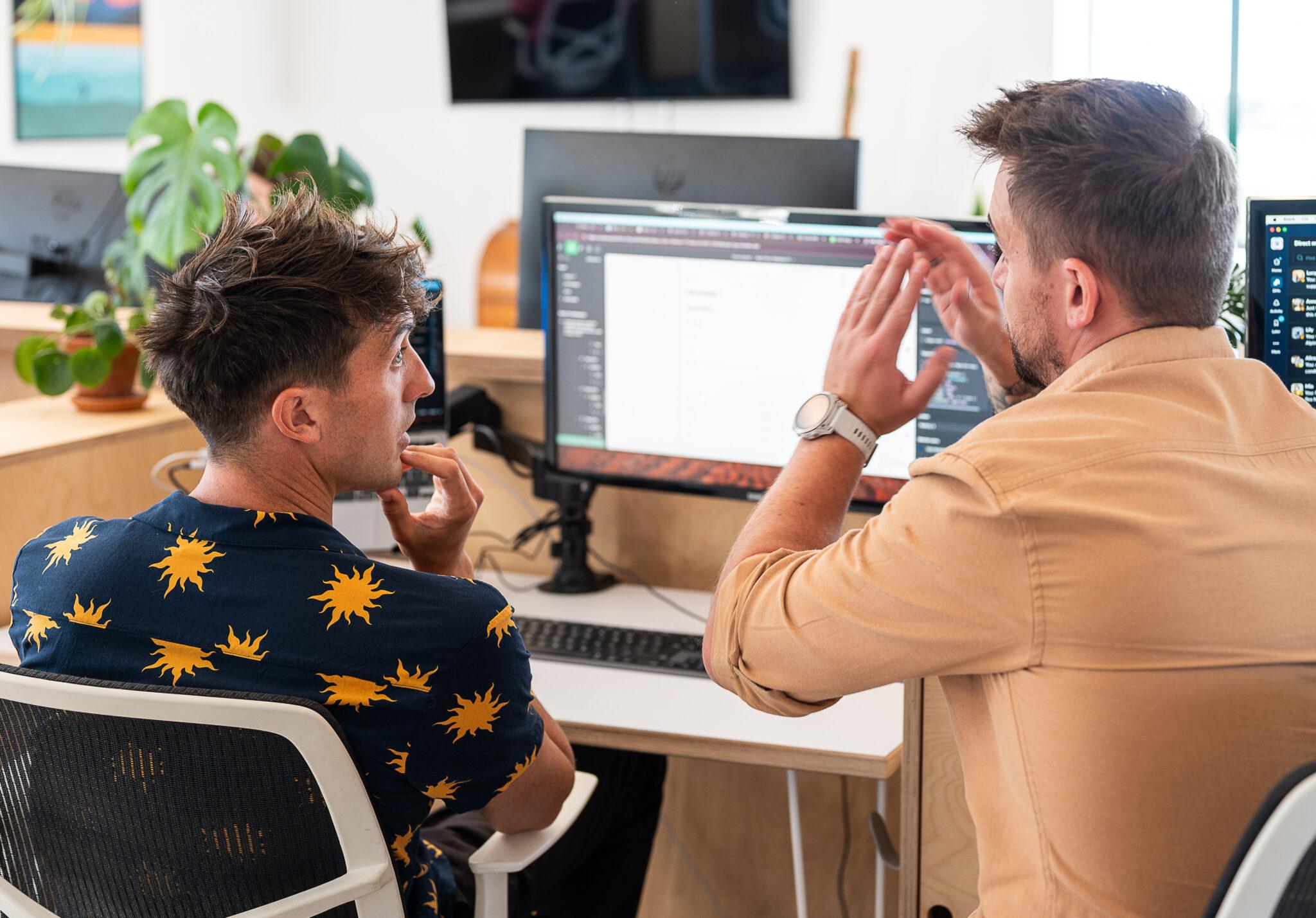 Website maintenance explained. Two Solve web developers talking through the maintence of a website.