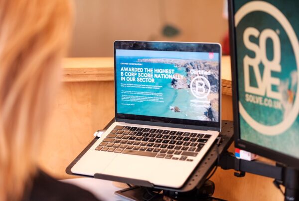 The Real Benefits of Entering Industry Awards 4 Benefits of entering industry awards. An over the shoulder view of a girl looking at Solves B-corp award.