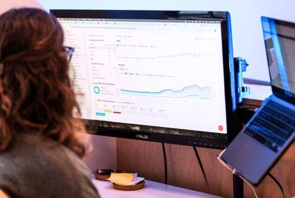 Woman looks at a computer screen showing the results of effectively used seo keywords