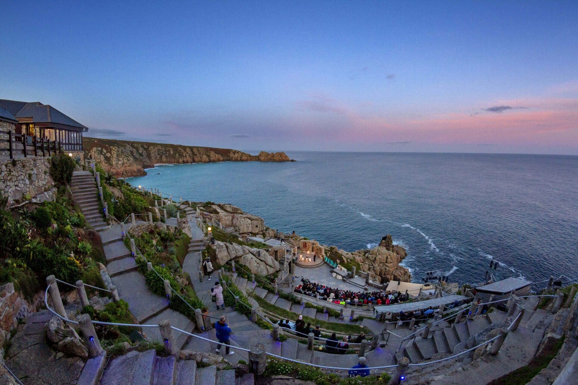 The Minack Theatre on the Cornish cliffs at sunset overlooking the sea