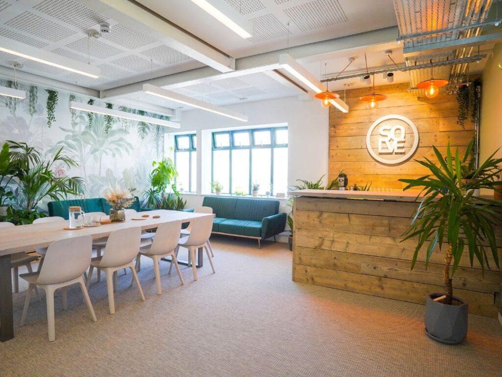 Solve meeting room with a bar, table and plants