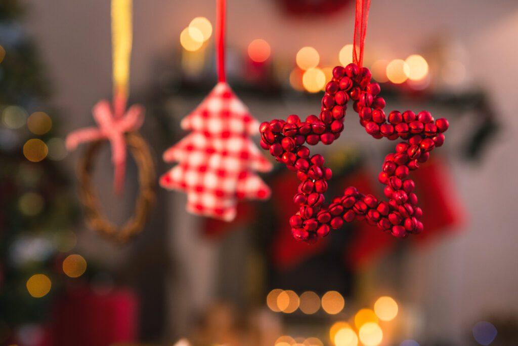 Christmas decorations hanging in a sparkly festive room.