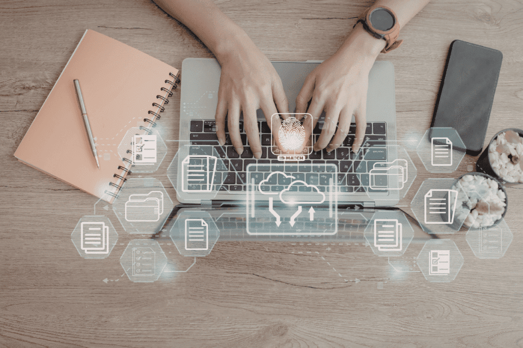 How to Use Content Planning Analytics to Improve Results 2 hands working on laptop keyboard with lots of different icons coming out of the pc that suggest the workflow of the person