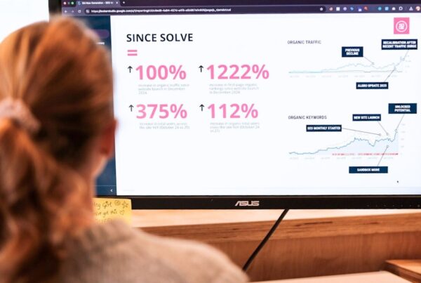 A girl sat on her computer looking at amazing results achieved through SEO and PPC marketing.