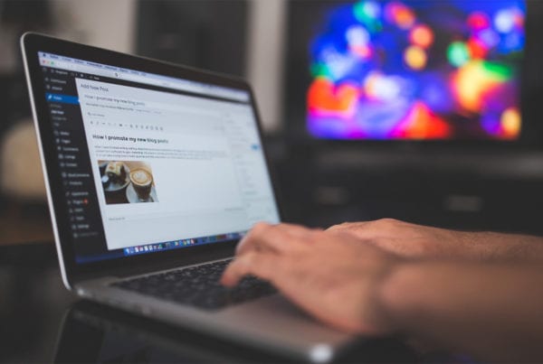 How to Write Top-ranking, Optimised Blog Posts 5 Writing a wordpress blog on a laptop